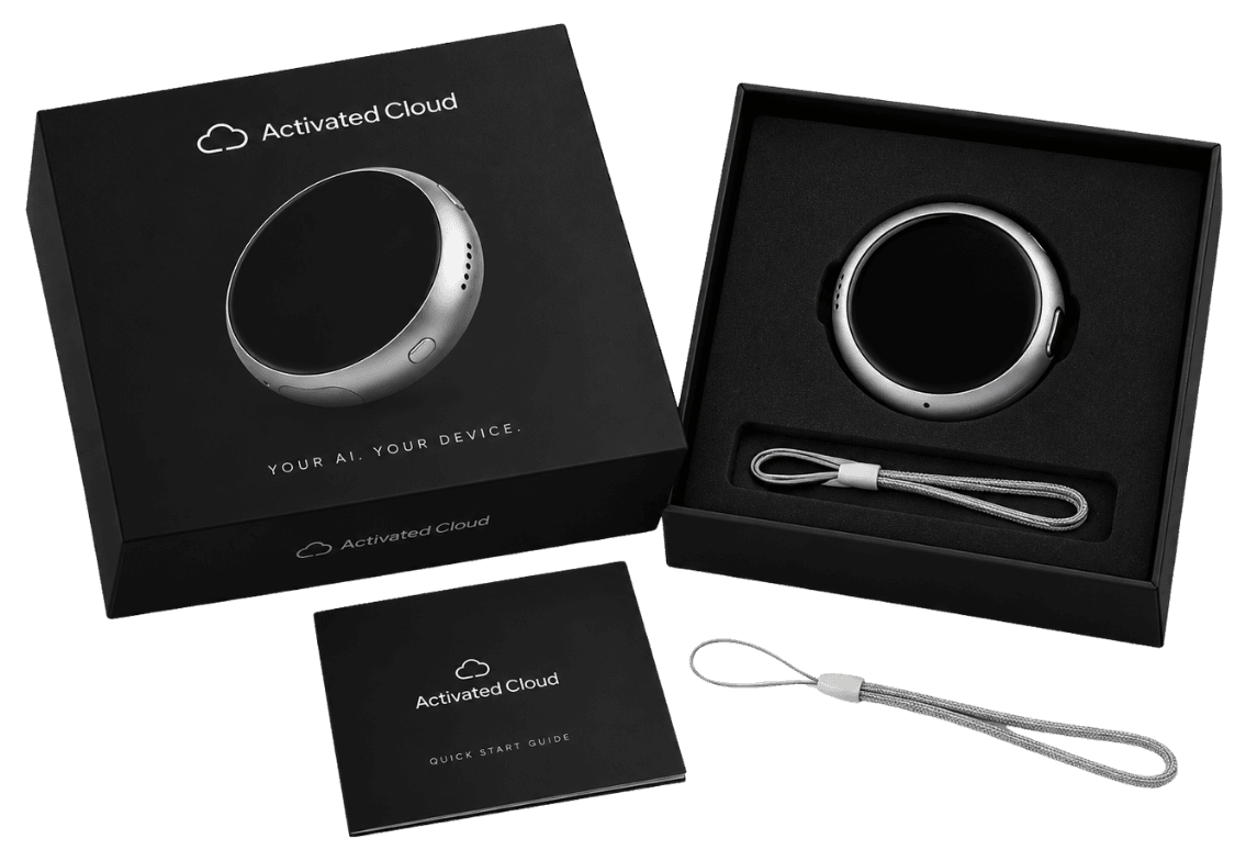 Cloudy in its box: the round aluminium device with the avatar lit on its screen.